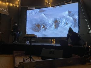 Kim Cunio and Heather Lee at Glastonbury 2024 -Sounds of space Project - Science Futures. Diana Scarborough video in background.