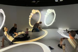 gold and silver rings on curved projection screen