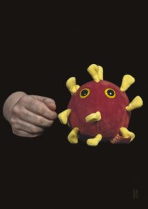 One fluffy toy of Covid microbe, red body with yellow spurs